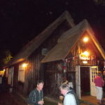 The photo shows Ranworth Village Hall lit up at night time for an event.