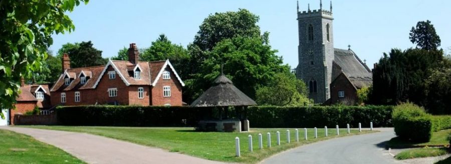 The photo shows the approach to the centre of the village of Woodbastwick.