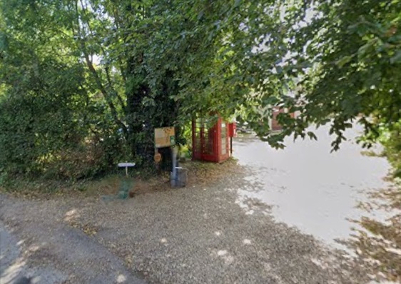 The photo shows our traditional red phone box and noticeboard located in Panxworth.