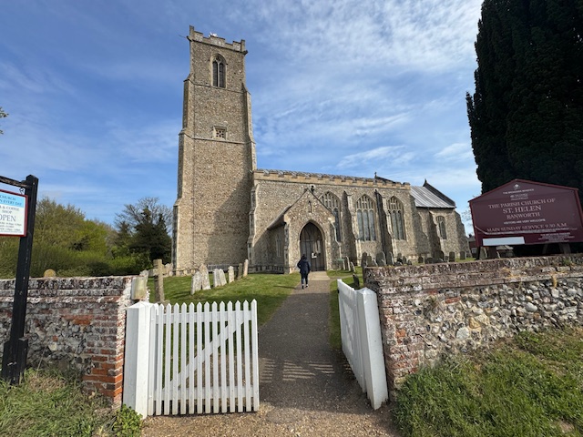 The photo shows the parish church of St Helens in Ranworth.